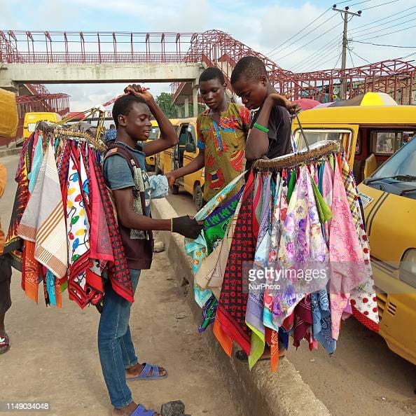 Boys selling handkerchiefs in Lagos traffic